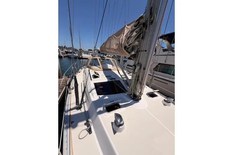 Slide: The Image of Sailing yacht Saga 409, 2007 model, docked at a marina under clear blue skies. - 26