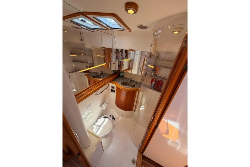 Slide: The Image of Luxurious bathroom interior of 2007 Saga 409 yacht with modern fixtures and wooden accents. - 98