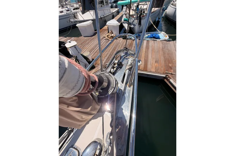 Slide: The Image of Sailboat deck view at marina, featuring a 2007 Saga 409 model. - 23