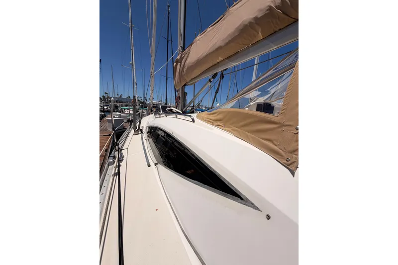 Slide: The Image of Sailing yacht Saga 409, 2007 model, docked at marina with clear blue sky. - 17