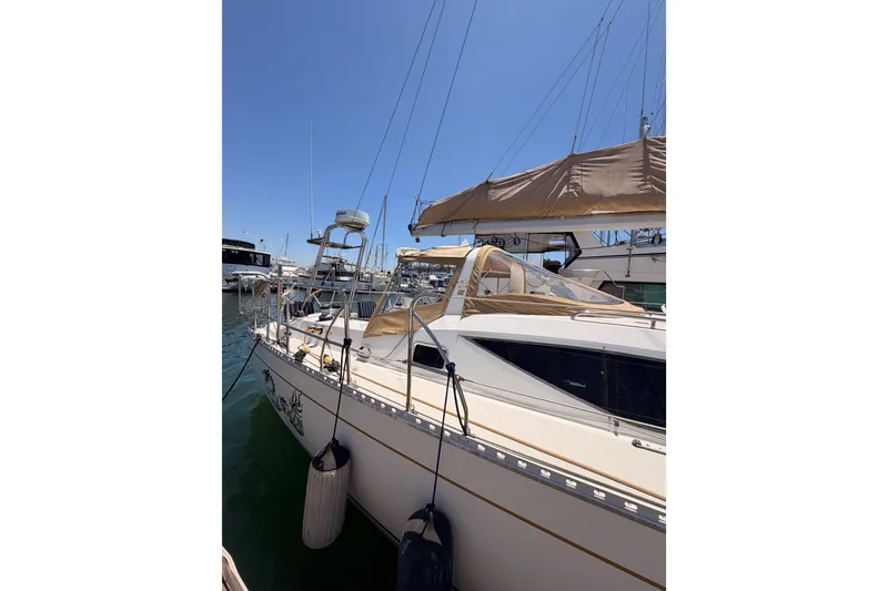 Slide: The Image of 2007 Saga 409 sailboat docked at marina under clear blue sky. - 4