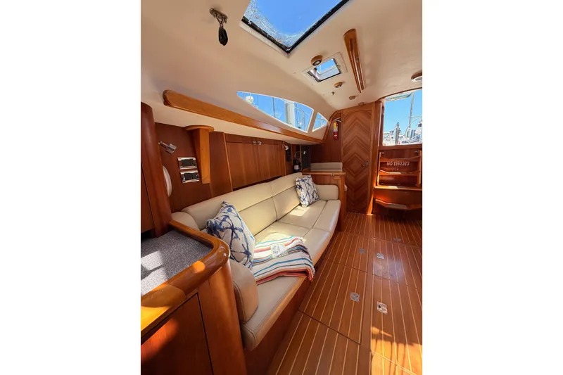 Slide: The Image of Luxurious 2007 Saga 409 yacht interior with elegant wood finish and comfortable seating. - 108