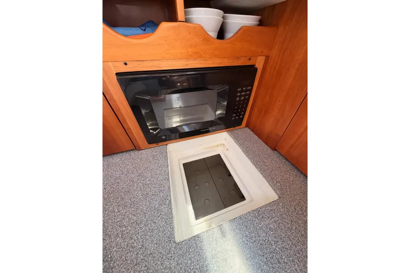 Slide: The Image of Microwave and storage area in 2007 Saga 409 boat kitchen. - 64