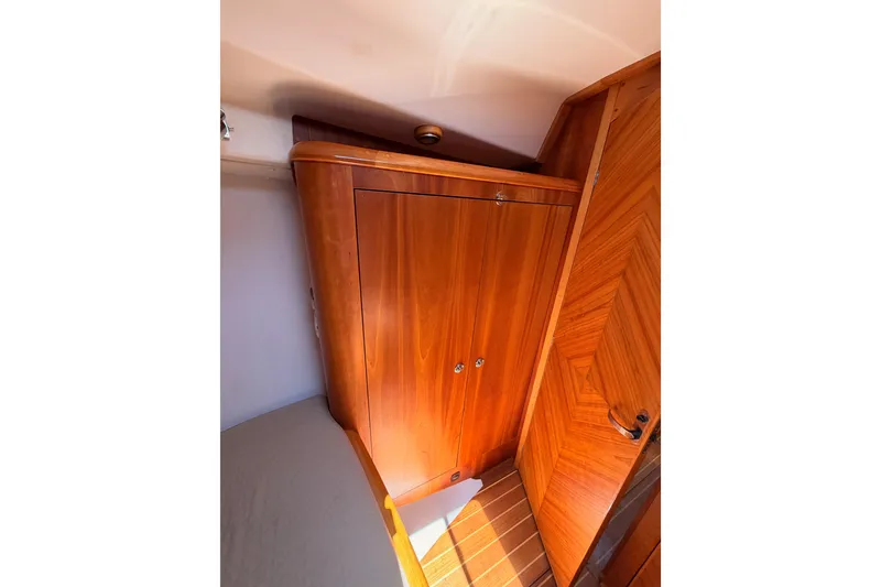 Slide: The Image of Wooden interior of 2007 Saga 409 yacht, featuring a sleek cabinet and door design. - 105