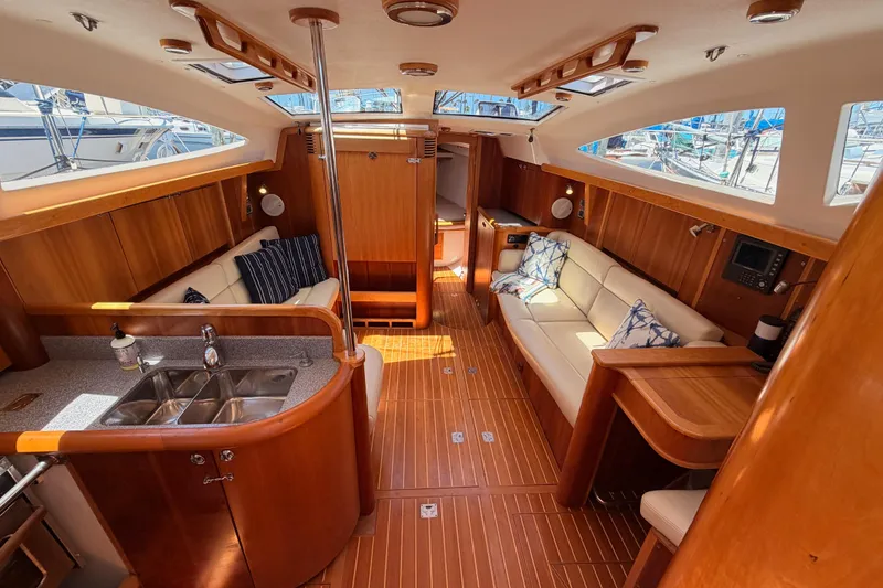 Slide: The Image of Luxurious 2007 Saga 409 yacht interior with wooden finish, spacious seating, and modern amenities. - 57