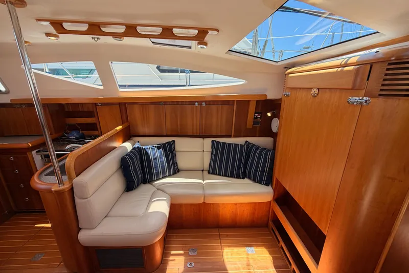 Slide: The Image of Luxurious interior of 2007 Saga 409 yacht with plush seating and elegant wood finish. - 88