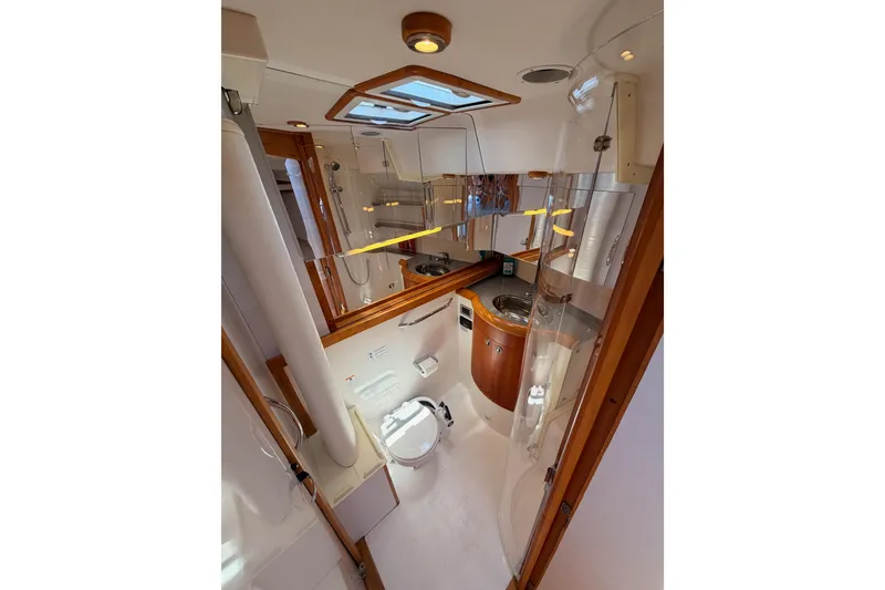 Slide: The Image of Luxurious bathroom interior of 2007 Saga 409 yacht, featuring modern fixtures and wood accents. - 100