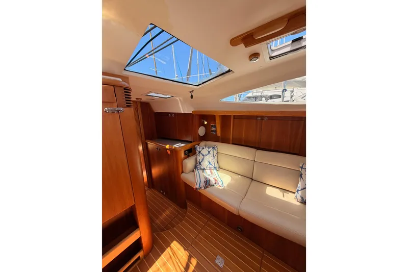 Slide: The Image of Luxurious interior of 2007 Saga 409 yacht with wooden finish and skylight. - 91