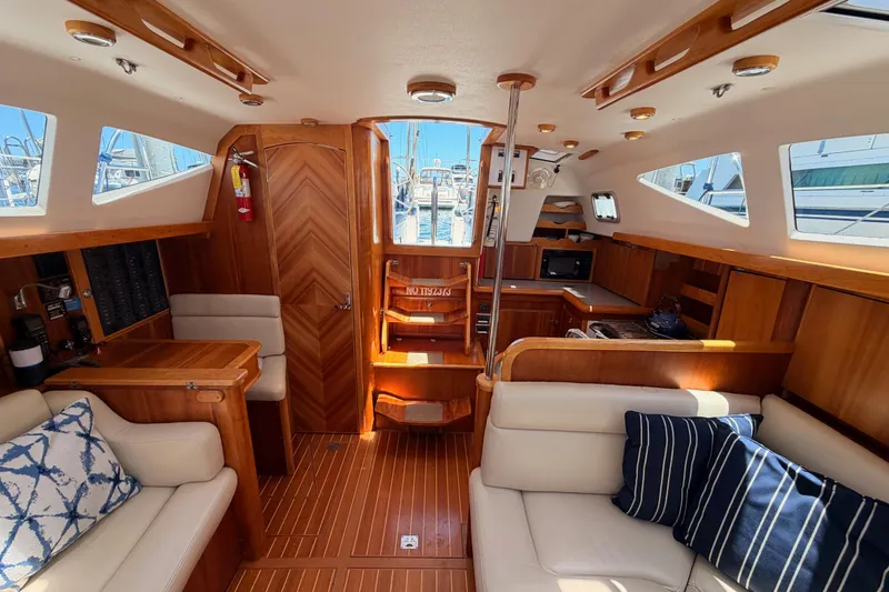 Slide: The Image of Luxurious 2007 Saga 409 yacht interior with wood finish, comfortable seating, and modern amenities. - 110