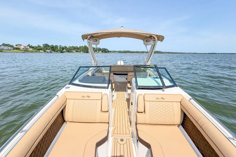 Slide: The Image of 2021 Sea Ray SDX 270 Outboard boat on calm water, featuring luxurious seating and sleek design. - 12