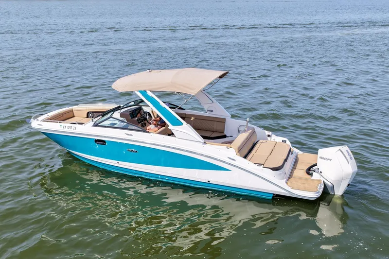 Slide: The Image of 2021 Sea Ray SDX 270 Outboard boat cruising on open water. - 3