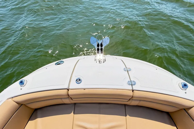 Slide: The Image of 2021 Sea Ray SDX 270 Outboard boat deck overlooking calm water. - 11