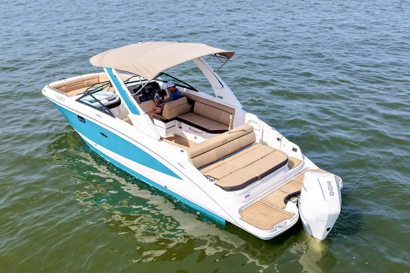 Slide: The Image of 2021 Sea Ray SDX 270 Outboard boat on water, featuring spacious seating and sleek design. - 4