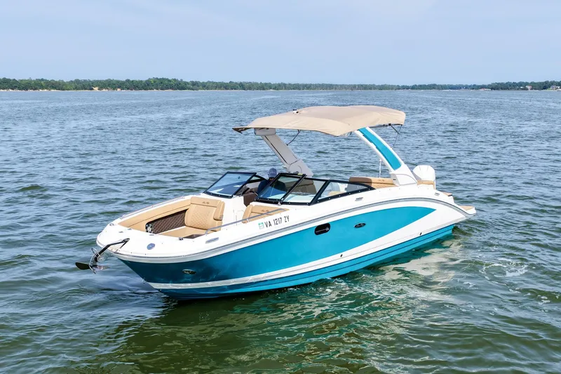 The Image of 2021 Sea Ray SDX 270 Outboard boat cruising on a calm lake. - 0