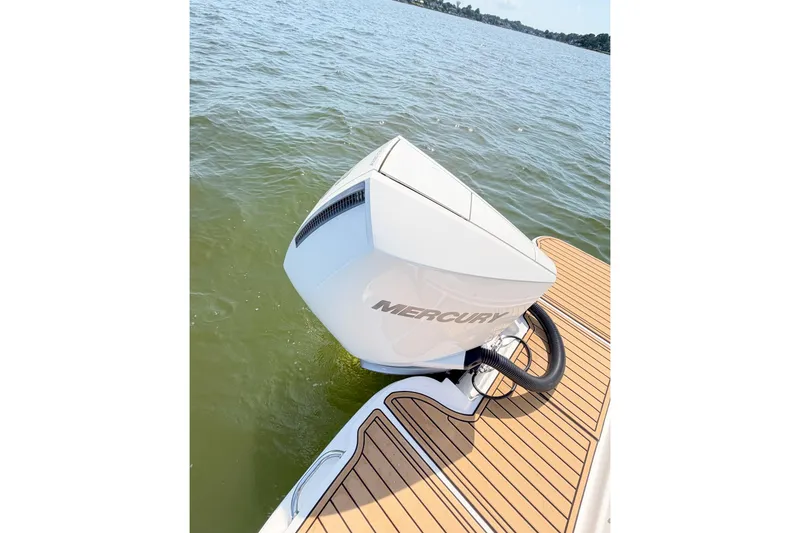 Slide: The Image of 2021 Sea Ray SDX 270 Outboard with Mercury engine on water. - 26