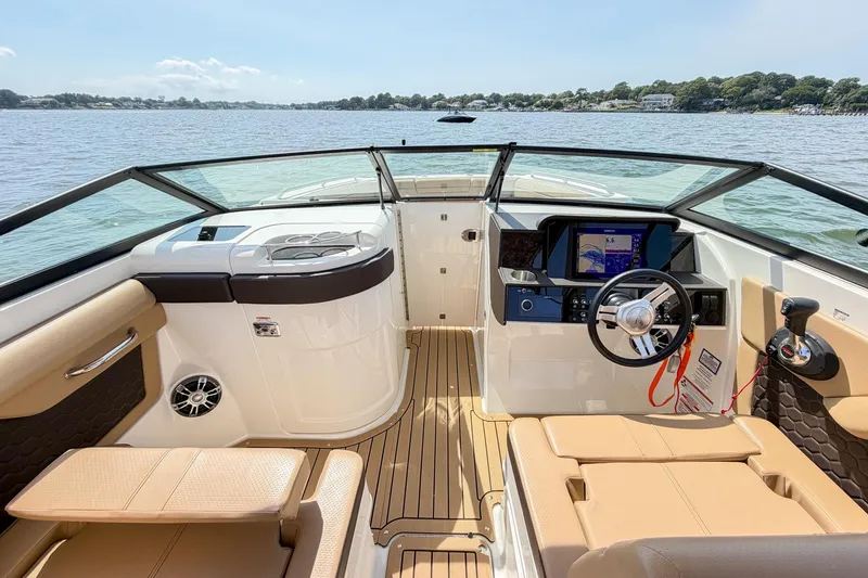 Slide: The Image of 2021 Sea Ray SDX 270 Outboard boat interior with modern dashboard and comfortable seating. - 24