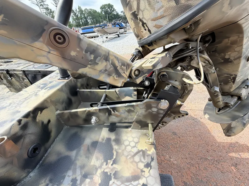 Slide: The Image of Close-up of a camouflaged boat steering system with aluminum components. - 3