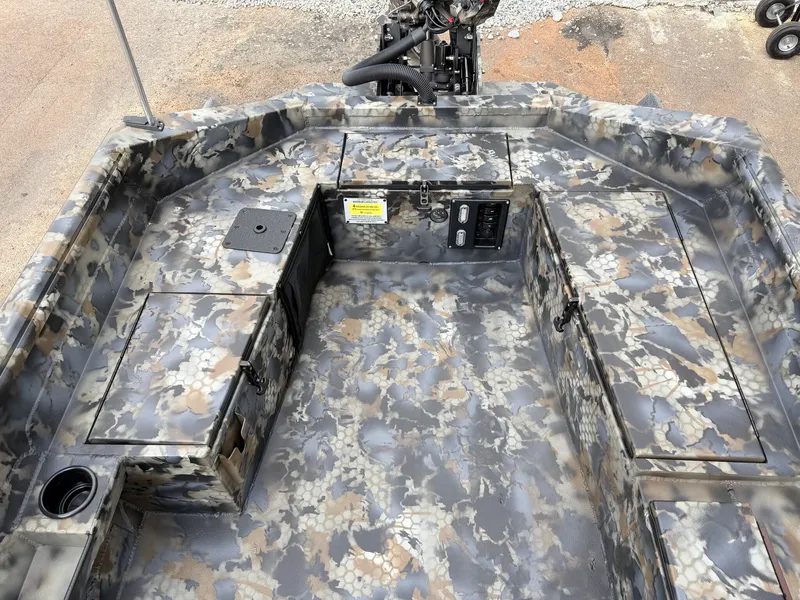 Slide: The Image of Interior view of a boat with camouflage pattern and storage compartments. - 9