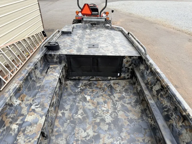 Slide: The Image of The image shows the interior of an Excel Viper F4 1751 boat with camouflage pattern. - 8