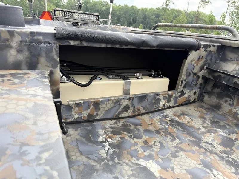 Slide: The Image of The image shows the interior of an Excel Viper F4 1751 boat with camouflage pattern. - 7