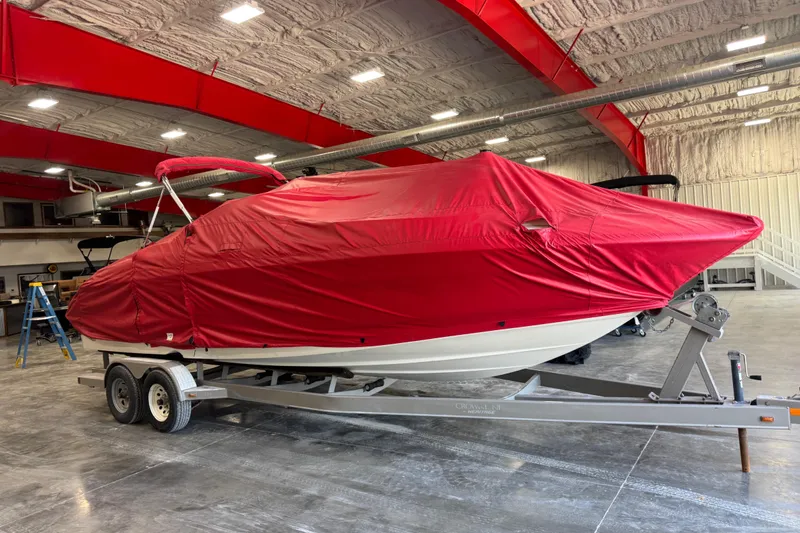 Slide: The Image of 2005 Monterey 268SS Super Sport boat covered in red tarp on trailer indoors. - 5