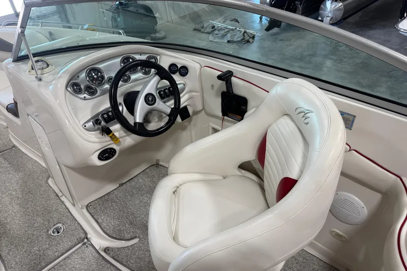 Slide: The Image of Interior of 2005 Monterey 268SS Super Sport boat with steering wheel and captain's seat. - 6