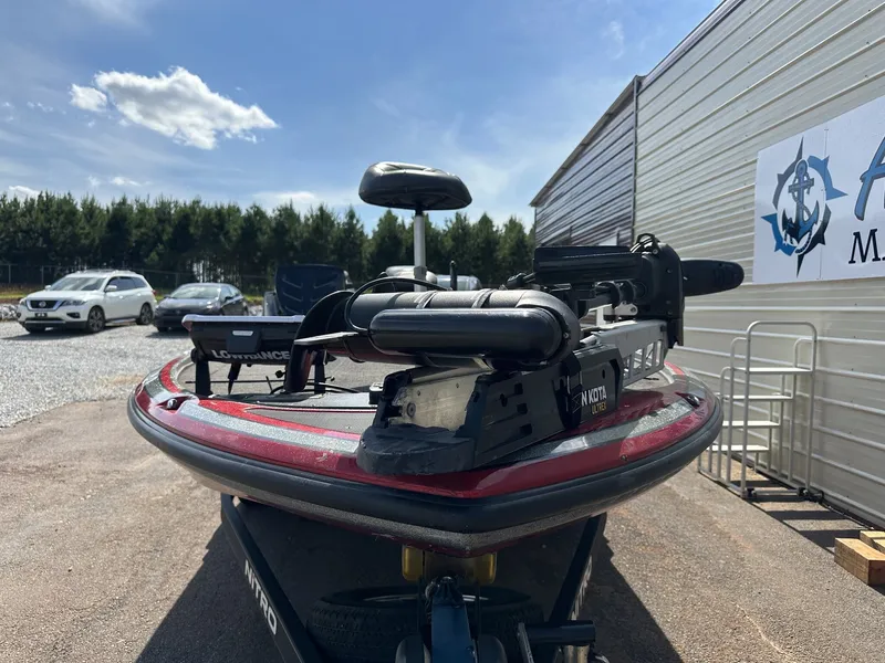 Slide: The Image of A 2017 Nitro Z Series Z19-200HP OPTI boat on a trailer beside a building. - 2