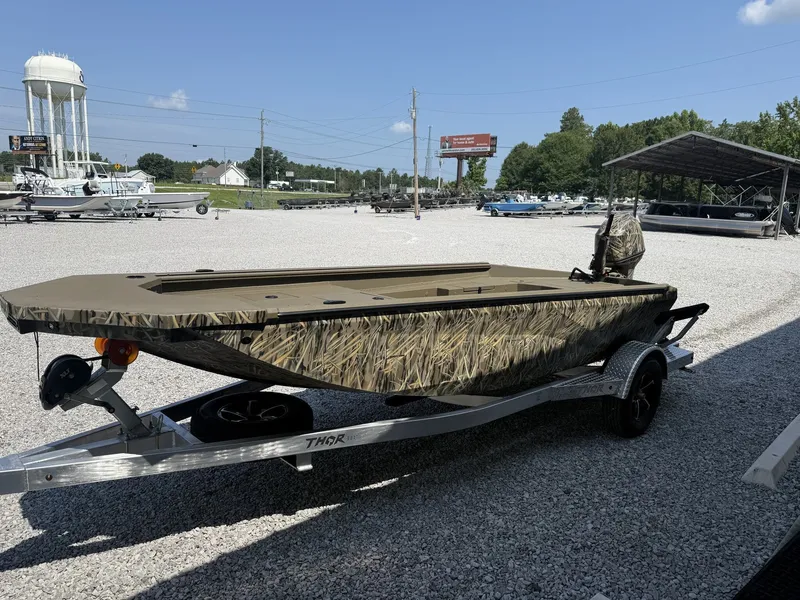 Slide: The Image of A Thor Fish Hammer boat on a trailer in an outdoor lot. - 3