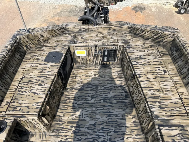 Slide: The Image of The boat features a camouflage pattern and an open cockpit with a steering console. - 5