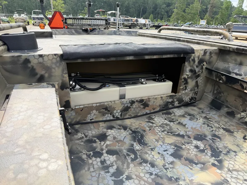 Slide: The Image of The image shows the interior of an Excel Viper F4 1751 boat with an aluminum trailer. - 5