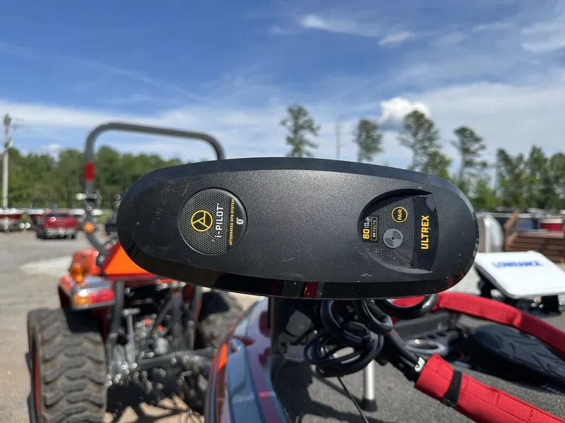 Slide: The Image of Close-up of a boat control device with trees in the background. - 4