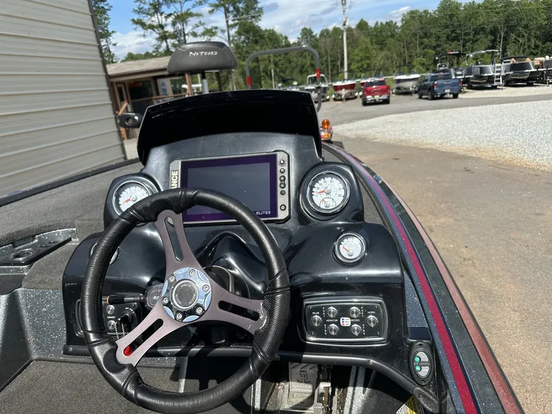 Slide: The Image of The image shows the cockpit of a 2017 Nitro Z Series Z19-200HP OPTI boat. - 7