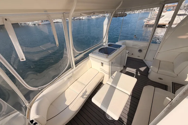 Slide: The Image of 2005 Cruisers Yachts 405 Express Motoryacht interior with seating and water view. - 26
