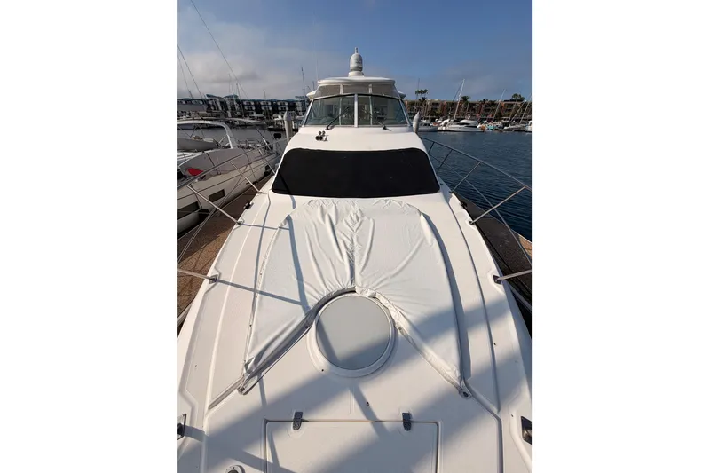 Slide: The Image of 2005 Cruisers Yachts 405 Express Motoryacht docked at marina, showcasing sleek design. - 21