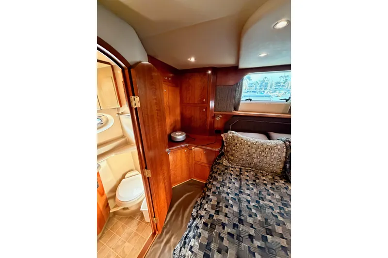 Slide: The Image of Luxurious 2005 Cruisers Yachts 405 Express Motoryacht cabin interior with bed and bathroom. - 82