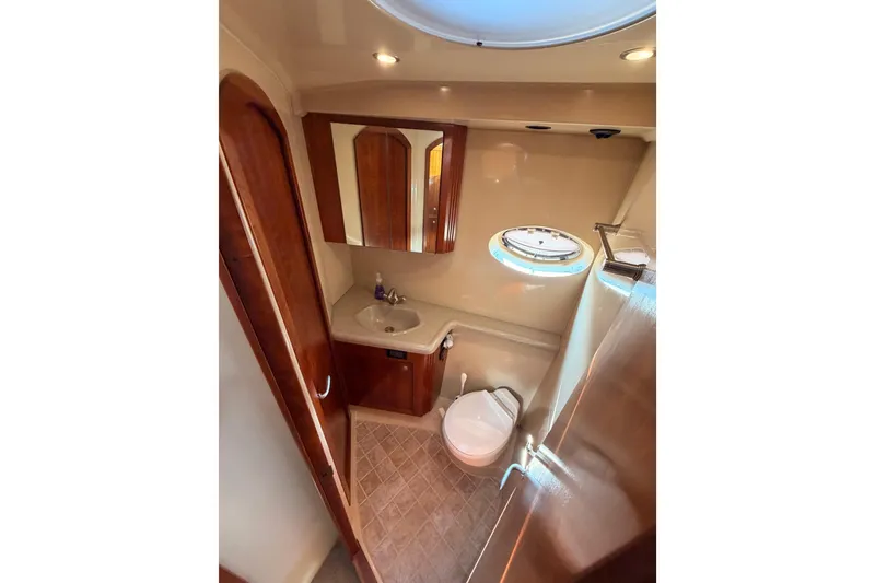 Slide: The Image of Luxurious bathroom in 2005 Cruisers Yachts 405 Express Motoryacht with elegant wood finishes. - 54