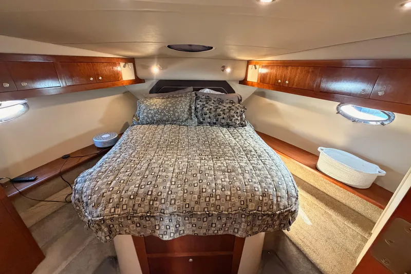 Slide: The Image of Luxurious bedroom interior of 2005 Cruisers Yachts 405 Express Motoryacht with cozy bedding. - 57