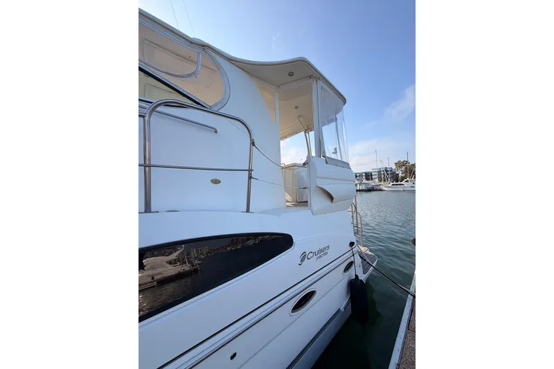 Slide: The Image of 2005 Cruisers Yachts 405 Express Motoryacht docked at marina, side view. - 6