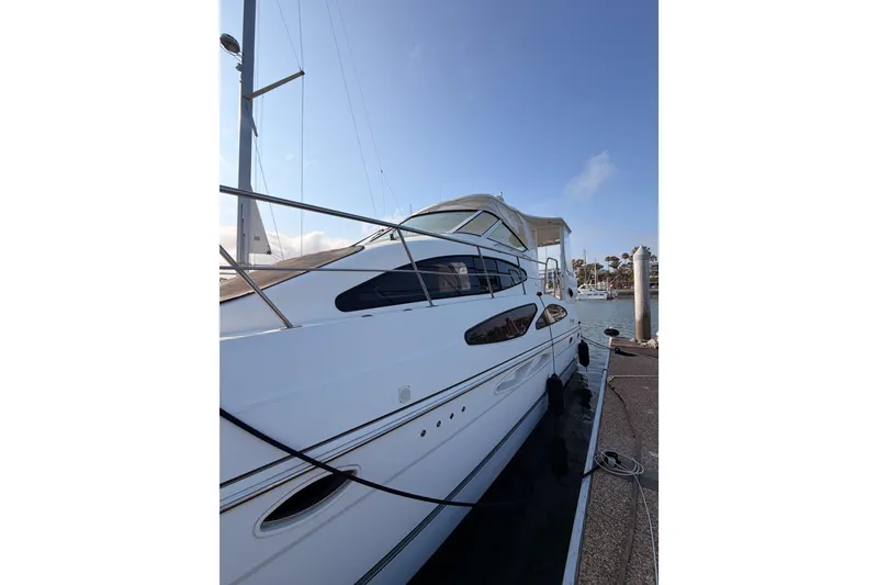 Slide: The Image of 2005 Cruisers Yachts 405 Express Motoryacht docked at marina, side view. - 4