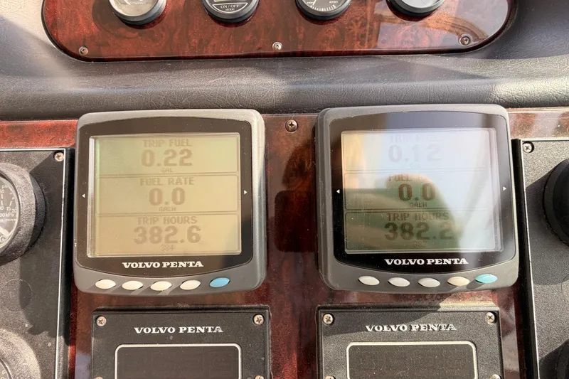 Slide: The Image of Volvo Penta displays on 2005 Cruisers Yachts 405 Express Motoryacht dashboard showing trip data. - 37