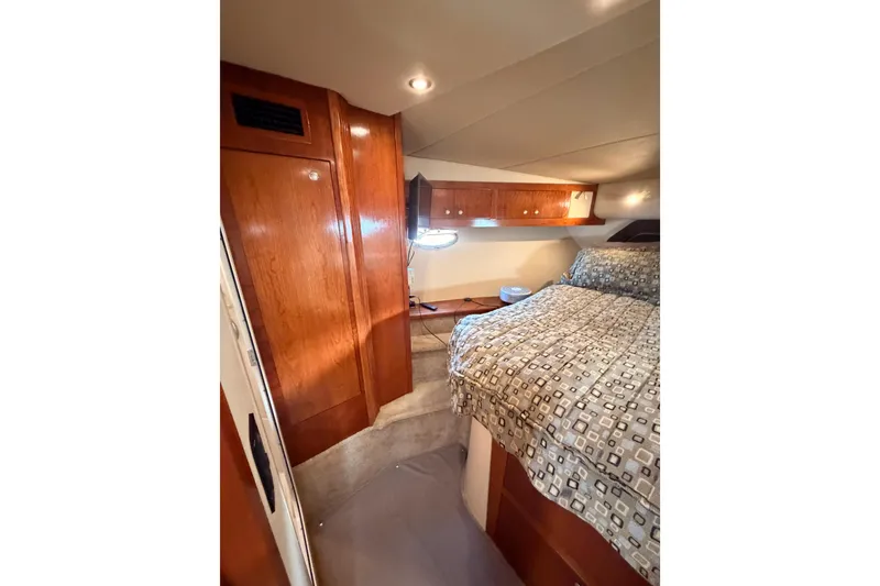 Slide: The Image of Luxurious cabin interior of 2005 Cruisers Yachts 405 Express Motoryacht with wood finishes. - 63
