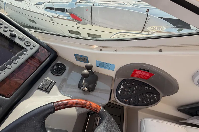 Slide: The Image of 2005 Cruisers Yachts 405 Express Motoryacht helm with controls and navigation equipment. - 36