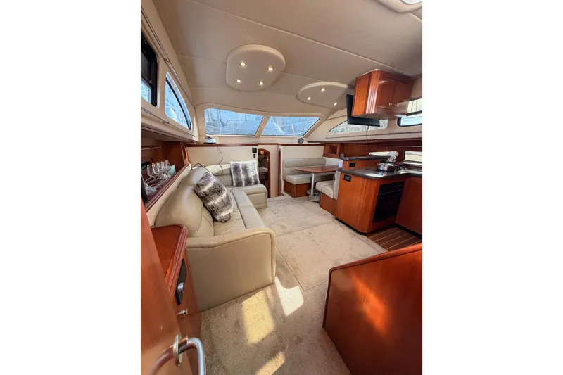 Slide: The Image of Luxurious interior of 2005 Cruisers Yachts 405 Express Motoryacht with plush seating and elegant wood finishes. - 87