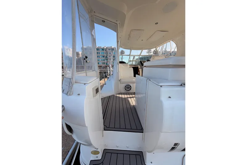Slide: The Image of 2005 Cruisers Yachts 405 Express Motoryacht interior with sleek white design and spacious layout. - 14