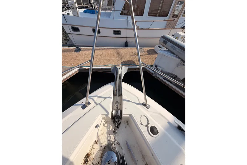 Slide: The Image of 2005 Cruisers Yachts 405 Express Motoryacht bow with anchor and dock view. - 20