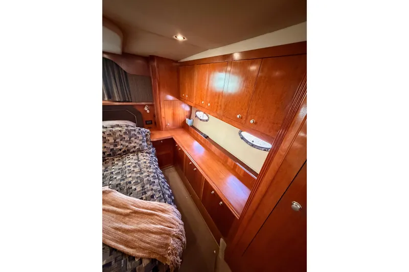 Slide: The Image of Luxurious cabin interior of 2005 Cruisers Yachts 405 Express Motoryacht with wood cabinetry. - 77