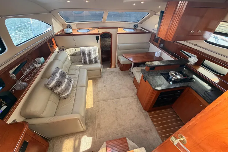 Slide: The Image of Luxurious 2005 Cruisers Yachts 405 Express Motoryacht interior with plush seating and modern kitchen. - 41