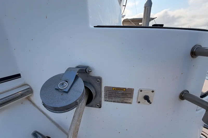 Slide: The Image of 2005 Cruisers Yachts 405 Express Motoryacht power connection and warning label detail. - 8