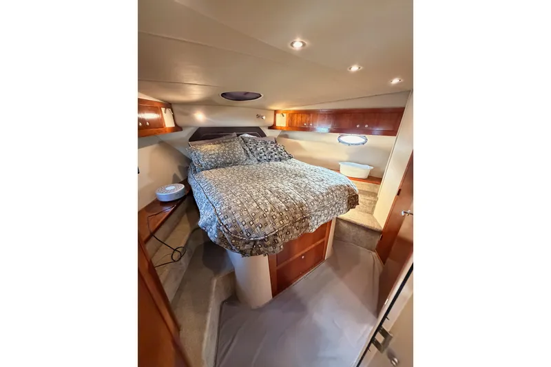 Slide: The Image of Luxurious bedroom interior of 2005 Cruisers Yachts 405 Express Motoryacht with cozy bedding. - 56