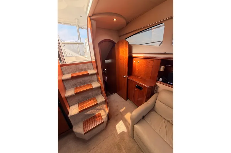 Slide: The Image of Interior of 2005 Cruisers Yachts 405 Express Motoryacht with stairs and seating area. - 71